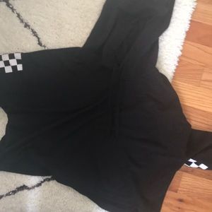 Cropped black hoodie with checkered sleeves